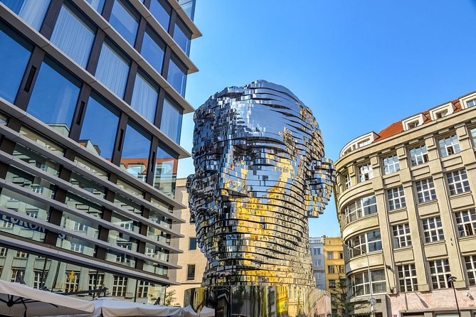 Discover Prague’s most Photogenic Spots with a Local - David Černý’s Man Hanging Out (Sigmund Freud): Thought on a Plate