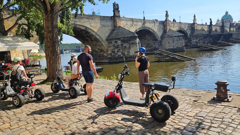Prague: City Highlights Tour by Electric Trike - Lennon Wall to Charles Bridge: the riverfront storyline