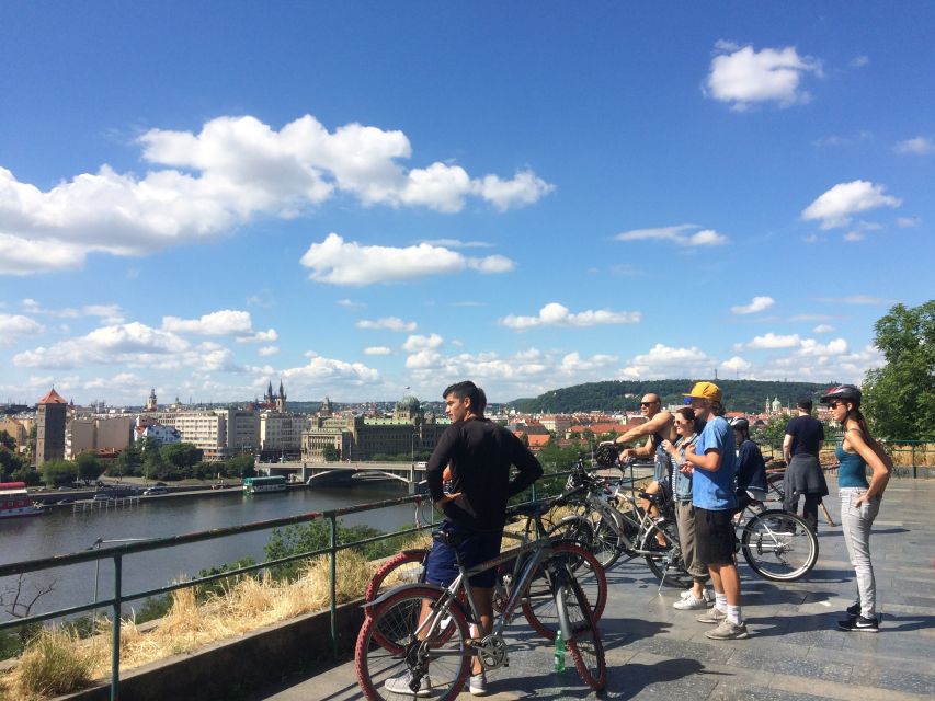 Prague: Stunning Viewpoints, Castle, City & Park Bike Tour - The Prague Metronome stop: a skyline view with a political backstory